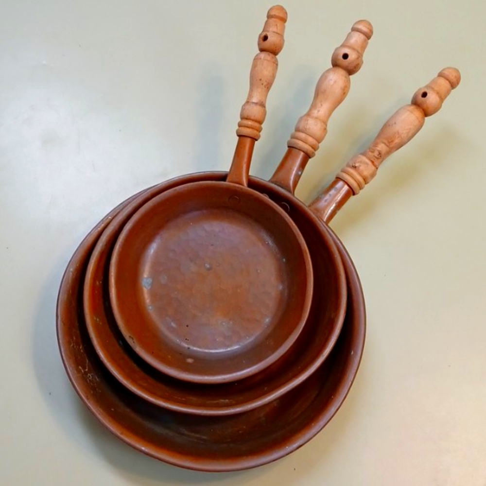 Vintage hammered copper pans